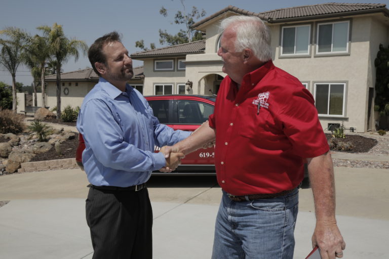 Raneri and Long contractor shaking hands with homeowner